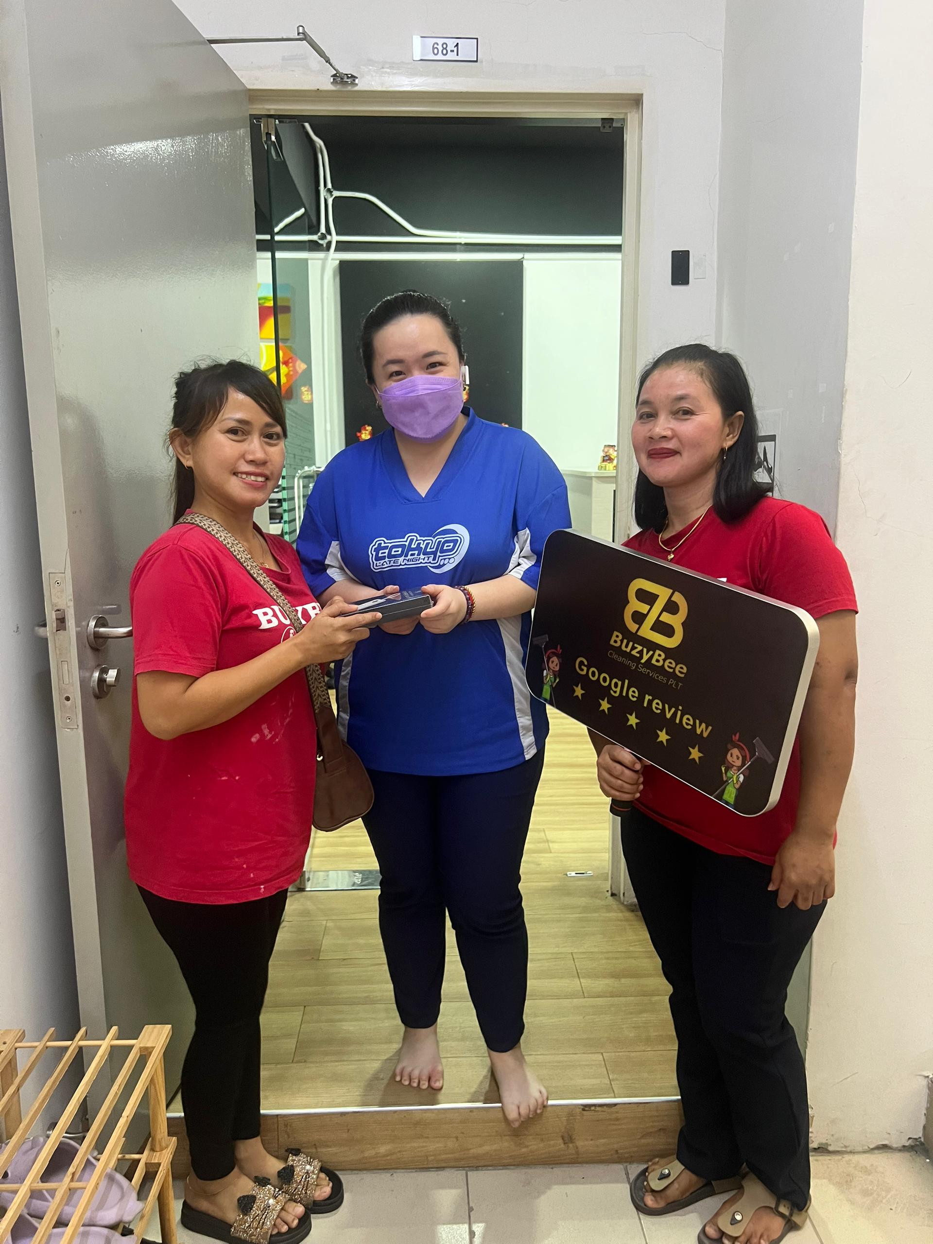 Female Customer in Blue Shirt Positive Review with BuzyBee Cleaning Services